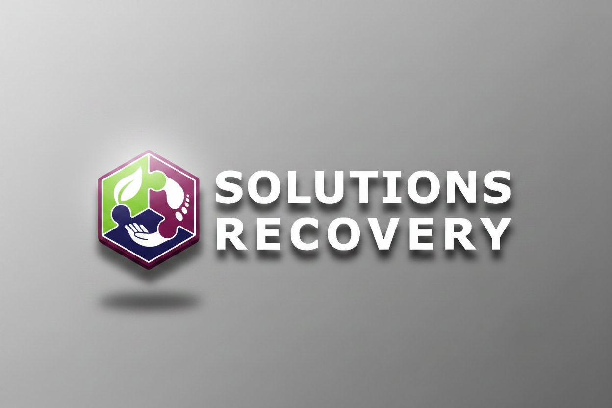 Logo with a green leaf, purple hexagon, and blue hand on a white background